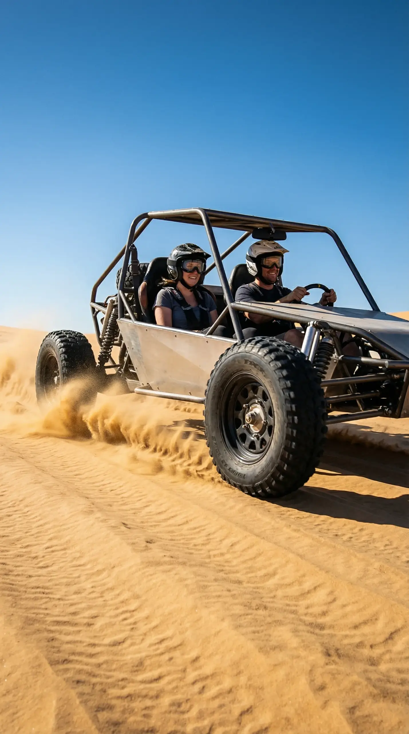 Couple riding a 2-seater dune buggy on open sand dunes in Dubai desert