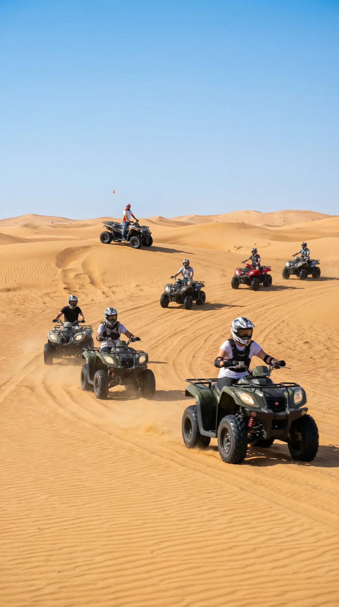 Group of riders enjoying a sharing quad bike experience in Dubai desert with instructor supervision